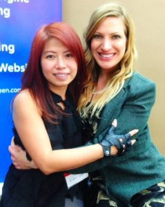 Author and fashion designer Hidi Lee and me, Rayne Hagstrom giving each other a hug after working together for over 7 years!