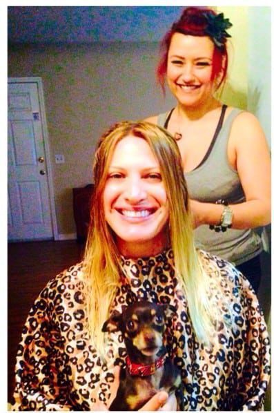 Hair stylist, Marlena Bansberg, coloring Rayne Parvis's hair int the kitchen with Frida (Rayne's dog).
